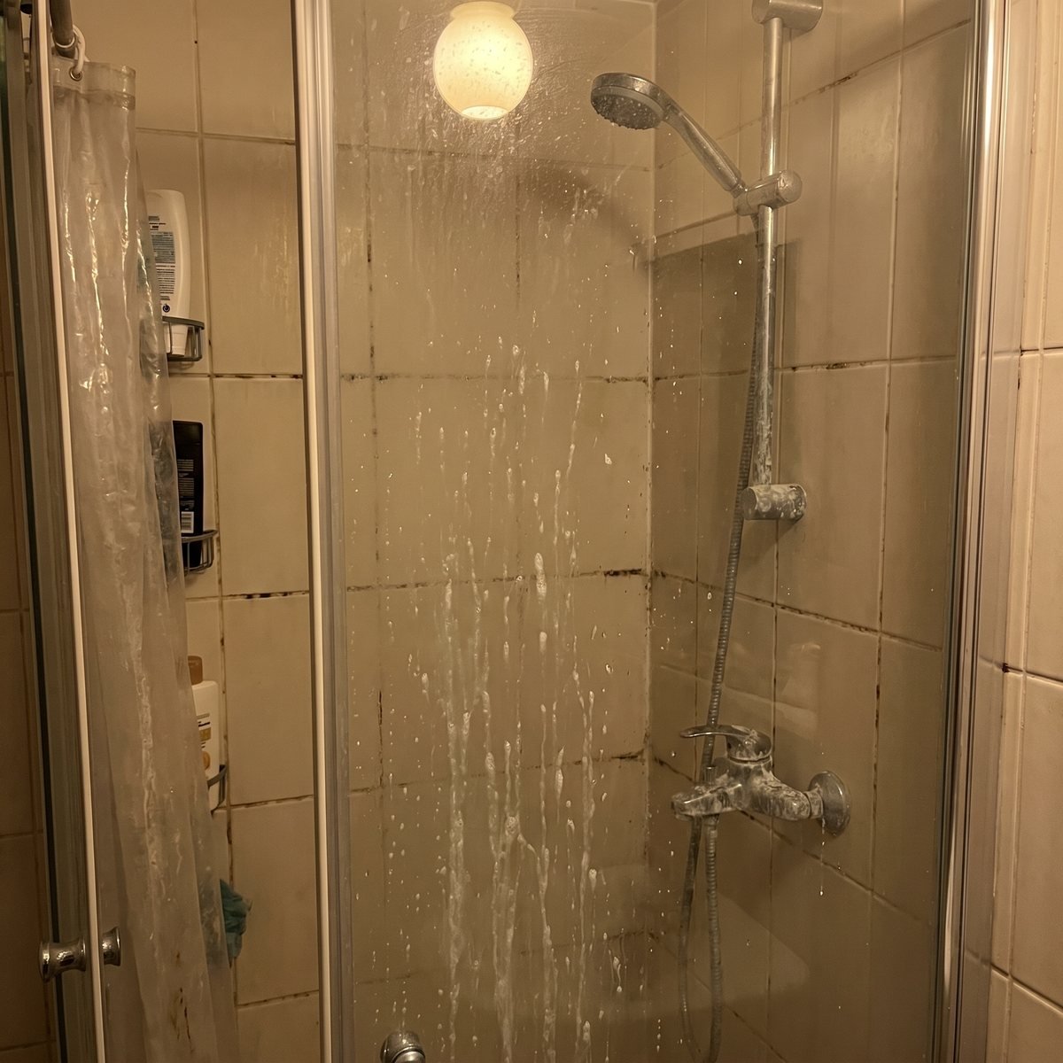 Shower before cleaning, soap scum and grime